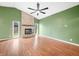 Spacious living room with brick fireplace and hardwood floors at 7817 Dartmouth Rd, Indianapolis, IN 46260