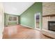 Living room with hardwood floors and green walls at 7817 Dartmouth Rd, Indianapolis, IN 46260