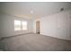 Cozy bedroom with soft carpet and a window, offering comfort and style at 7872 Magnolia St, New Palestine, IN 46163