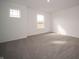 Cozy bedroom with soft carpet, two windows, and neutral paint, providing a relaxing atmosphere at 7872 Magnolia St, New Palestine, IN 46163