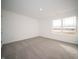 Bright bedroom features plush carpet, a large window, and neutral decor at 7872 Magnolia St, New Palestine, IN 46163