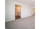 Bright bedroom featuring plush carpet and an ensuite bathroom for added convenience at 7872 Magnolia St, New Palestine, IN 46163