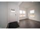 Bright entryway with dark floors, white walls, and a decorative glass accent in the front door at 7872 Magnolia St, New Palestine, IN 46163