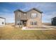 Charming two-story home featuring brown siding, brick accents, and a well-manicured lawn at 7872 Magnolia St, New Palestine, IN 46163