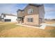 Attractive two-story home showcasing brown siding, brick accents, and attached garage on a sunny day at 7872 Magnolia St, New Palestine, IN 46163
