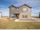 Charming two-story home featuring brown siding, brick accents, well-manicured lawn, and inviting front entrance at 7872 Magnolia St, New Palestine, IN 46163