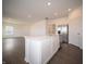 Open-concept kitchen featuring a central island, stainless steel appliances, and seamless flow into the living area at 7872 Magnolia St, New Palestine, IN 46163