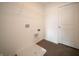Functional laundry room with overhead shelving, a utility sink, and easy access to laundry connections at 7872 Magnolia St, New Palestine, IN 46163