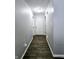 Bright hallway with grey walls and dark hardwood floors at , Greenwood, IN 46143