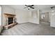 Living room with stone fireplace and carpet at 8371 S Paddleboat Ln, Pendleton, IN 46064