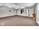 Finished basement with neutral carpeting and recessed lighting at 9210 Briarclift Rd, Indianapolis, IN 46256
