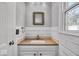 Small bathroom with white vanity and shiplap walls at 9210 Briarclift Rd, Indianapolis, IN 46256