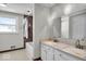 Clean bathroom with a tub and double vanity at 9210 Briarclift Rd, Indianapolis, IN 46256