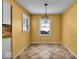 Bright dining area with tile flooring and large windows at 9210 Briarclift Rd, Indianapolis, IN 46256
