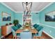 Elegant dining room with hardwood floors and a stylish light fixture at 9210 Briarclift Rd, Indianapolis, IN 46256
