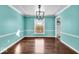 Bright dining room with hardwood floors and large windows at 9210 Briarclift Rd, Indianapolis, IN 46256