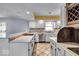 Spacious kitchen with white cabinets and breakfast bar at 9210 Briarclift Rd, Indianapolis, IN 46256