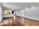 Hardwood floor living room with kitchen and hallway views at 9210 Briarclift Rd, Indianapolis, IN 46256
