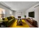 Spacious living room with hardwood floors, fireplace, and large windows at 9210 Briarclift Rd, Indianapolis, IN 46256