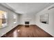 Bright living room featuring hardwood floors and a fireplace at 9210 Briarclift Rd, Indianapolis, IN 46256
