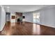 Living room with hardwood floors, fireplace, and built-in shelving at 9210 Briarclift Rd, Indianapolis, IN 46256