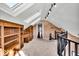 Bright loft area with built-in shelving and skylights at 9210 Briarclift Rd, Indianapolis, IN 46256