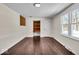 Bright office features hardwood floors, built-in shelves, and large windows at 9210 Briarclift Rd, Indianapolis, IN 46256
