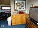 Wet bar with sink, cabinets, and a large framed print at 941 Sleepy Hollow Pl, Greenwood, IN 46142