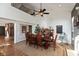 Formal dining room with hardwood floors, large table, and ceiling fan at 9610 Wickland Ct, Fishers, IN 46037