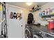 Laundry room with washer, dryer, and ample storage shelving at 9610 Wickland Ct, Fishers, IN 46037