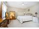 Bedroom with a queen bed, dresser, and wood armoire at 9667 Spruance Ct, Indianapolis, IN 46256