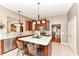 Island kitchen with stainless steel appliances and wood cabinets at 9967 Jasper Ct, Noblesville, IN 46060