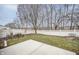 Fenced backyard with patio and mature trees at 10832 Harness Way, Indianapolis, IN 46239