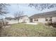 Brick home backyard with small patio at 10832 Harness Way, Indianapolis, IN 46239