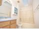Clean bathroom with a tub, toilet, and vanity at 10832 Harness Way, Indianapolis, IN 46239