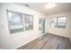 Bright dining area with vinyl flooring and sliding glass doors leading to backyard at 10832 Harness Way, Indianapolis, IN 46239
