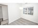 Bright dining room features hardwood floors and a window overlooking the yard at 10832 Harness Way, Indianapolis, IN 46239