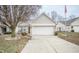 Brick ranch home with attached garage and landscaping at 10832 Harness Way, Indianapolis, IN 46239