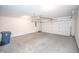 Spacious garage with overhead door and ample storage space at 10832 Harness Way, Indianapolis, IN 46239