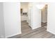 View of kitchen with white cabinets, gray countertops, and stainless steel appliances at 10832 Harness Way, Indianapolis, IN 46239