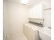 Laundry room with washer, dryer, cabinets, and utility sink at 10832 Harness Way, Indianapolis, IN 46239
