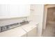 Convenient laundry room with washer, dryer, and access to a bathroom at 10832 Harness Way, Indianapolis, IN 46239