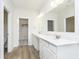 Bathroom with double vanity and modern fixtures, with a closet to the side at 10948 Hanovarian St, Zionsville, IN 46077