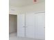 Bedroom with closet with sliding doors, plush carpeting, and an open door at 10948 Hanovarian St, Zionsville, IN 46077