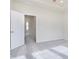 Neutral-toned bedroom with an open doorway and plush carpeting at 10948 Hanovarian St, Zionsville, IN 46077
