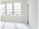 Bright bedroom featuring three large grid windows, filling the space with natural light at 10948 Hanovarian St, Zionsville, IN 46077