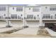 Exterior elevation showing the back of the home, garages, and balconies at 10948 Hanovarian St, Zionsville, IN 46077