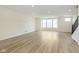 This spacious living room features hardwood floors, recessed lighting and large windows at 10948 Hanovarian St, Zionsville, IN 46077