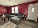 Spacious living room with L-shaped sofa and hardwood floors at 1220 Victoria Dr, Lebanon, IN 46052