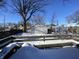 View of the backyard and detached garage in winter at 1318 N Lasalle St, Indianapolis, IN 46201